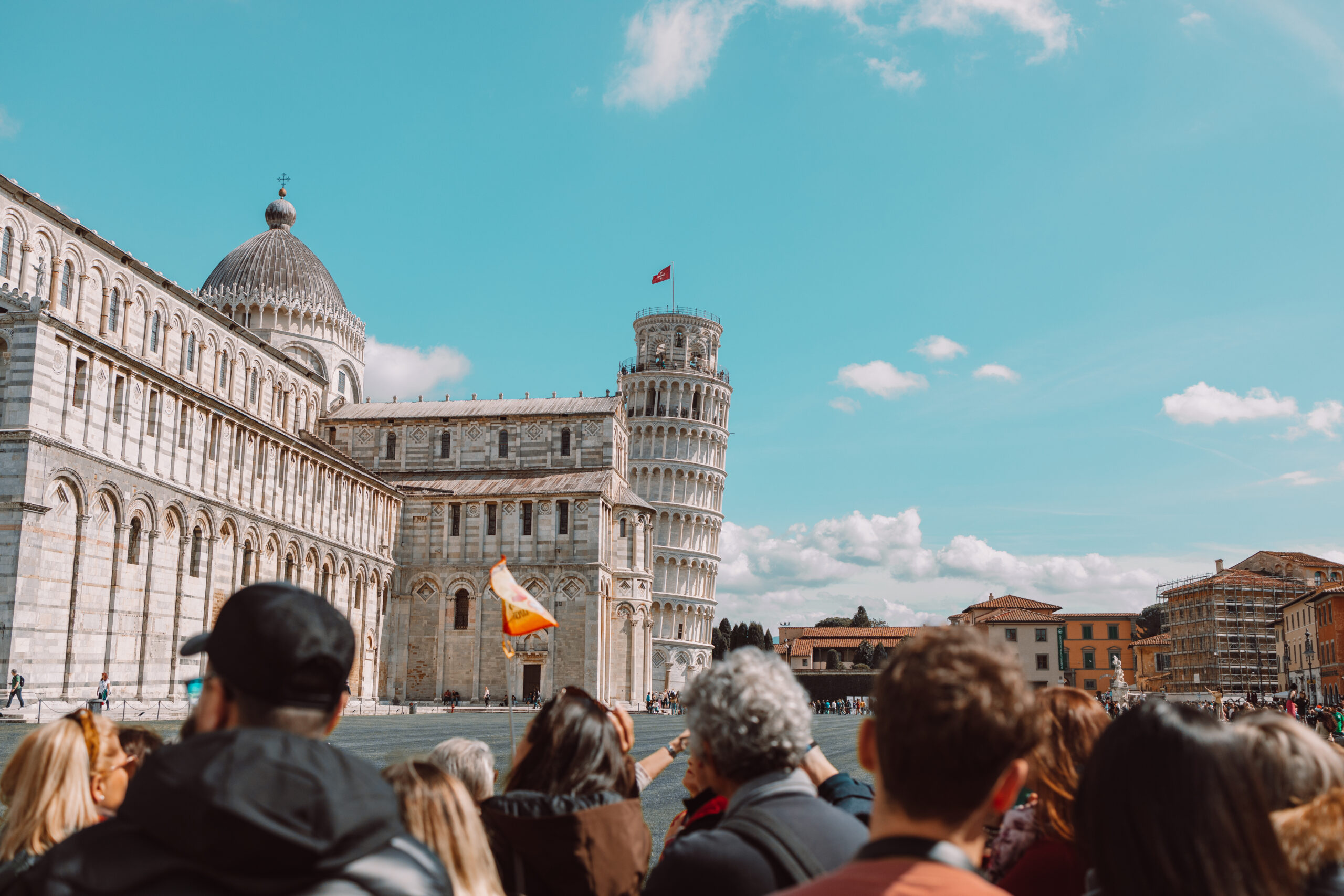 Pisa, Italy – March 18, 2023: Tourists packing the cathedral of Santa Maria Assunta and leaning tower in Piazza dei Miracoli also known as Piazza del Duomo, Pisa, Italy