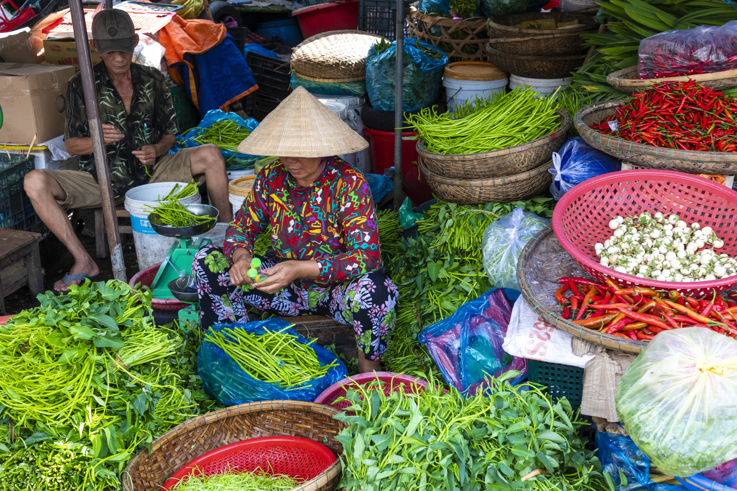 Sellers on the local market in Vietnam. Traditional food market